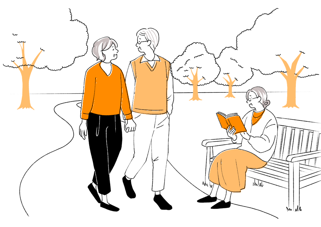 公園で散歩する人と読書する人